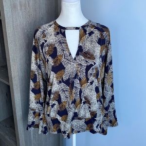 Veronica M patterned top, faux wrap style with banded hem. Size XL.